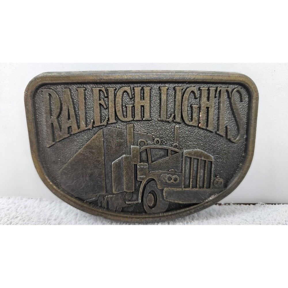 Vintage Raleigh Lights Trucker Belt Buckle Metal Semi Truck Logo Brass Tone